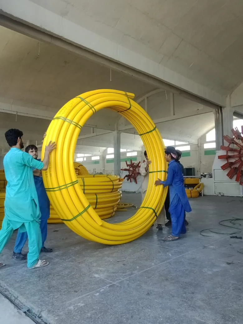 Team handling MDPE gas pipe coil